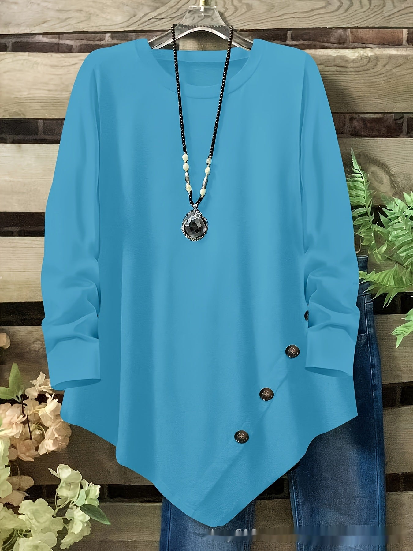 Long Sleeves With An Irregular Hem And Button Detailing