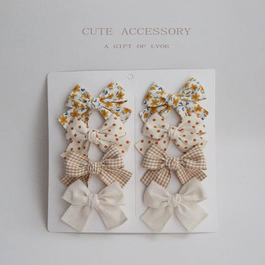 Dovetail Bow Around A Pair Of Hairclips 1 Group