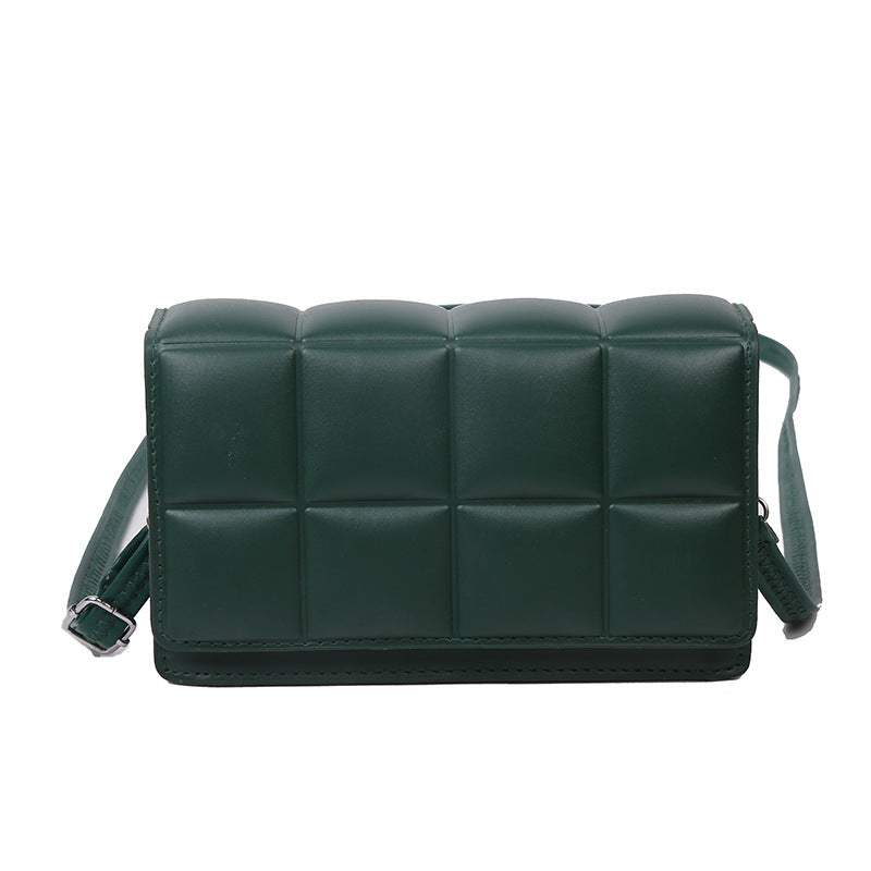 A small square bag with one shoulder and cross body