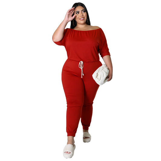 Ensfarvet sportsjumpsuit til kvinder med snøre, høj talje og slankende design