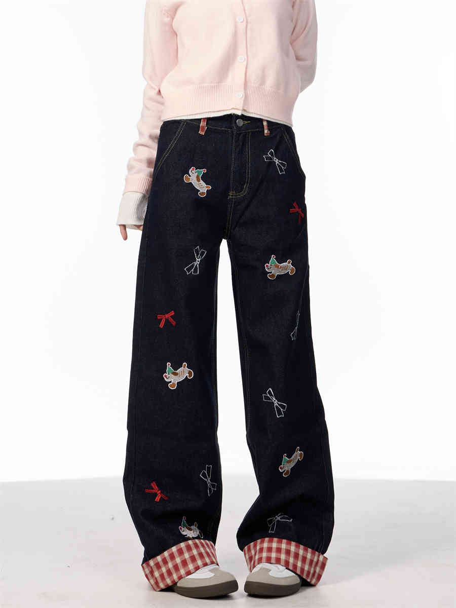 Vintage jeans med broderet sløjfe, hvalpemotiv og vide ben samt høj talje