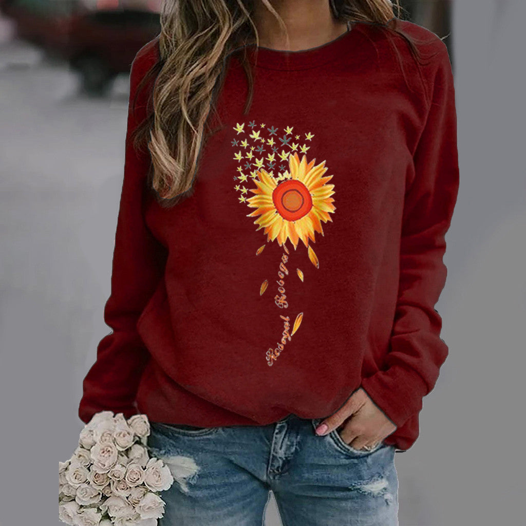 Langærmet sweater med solsikkemønster og rund hals