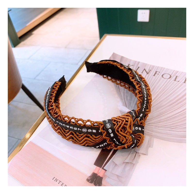 Handmade twisted letter ribbon with knotted headband in the middle