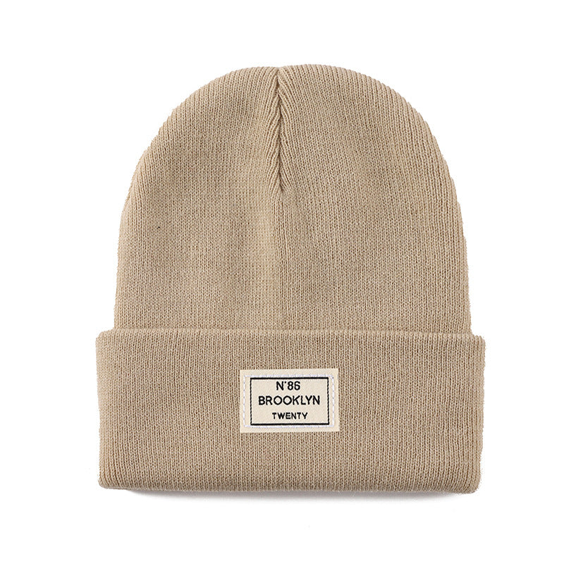 Knitted Beanie With Brand Label Stylish And Fashionable