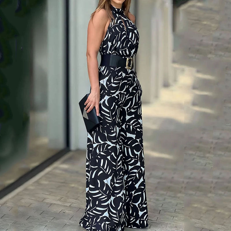 Sommerlig, elegant og moderigtig ærmeløs jumpsuit med halv rullekrave, print, hulmønster og snøret vidde ben