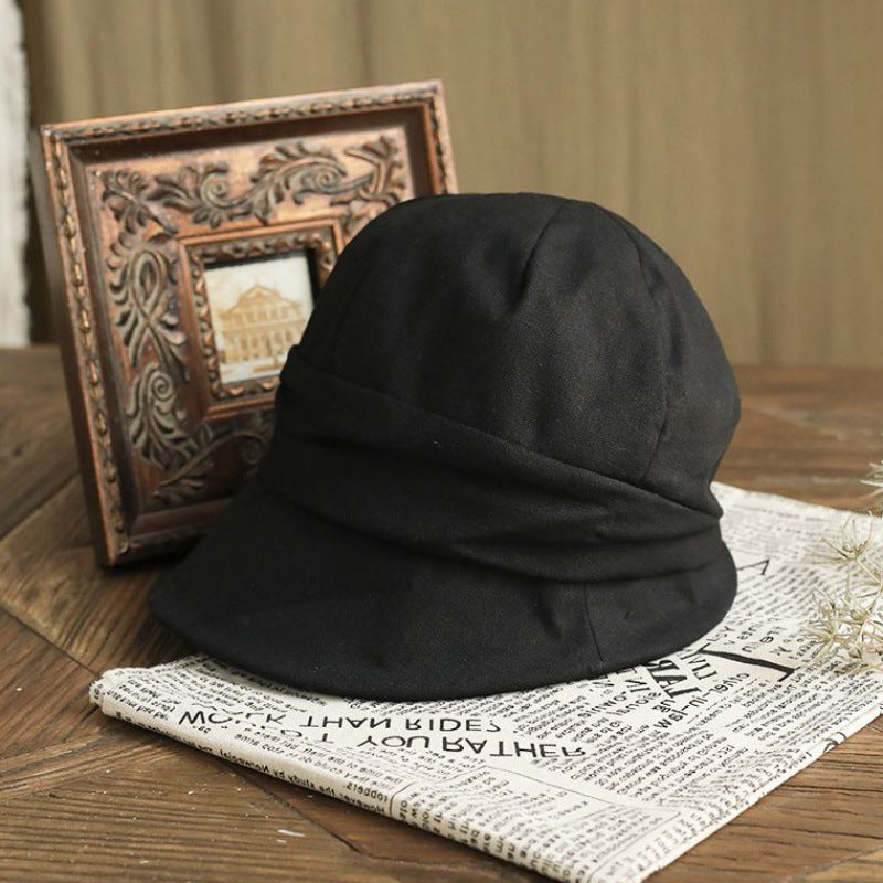 Kunstnerisk afslappet bøllehat med top og krøllet vintage-look