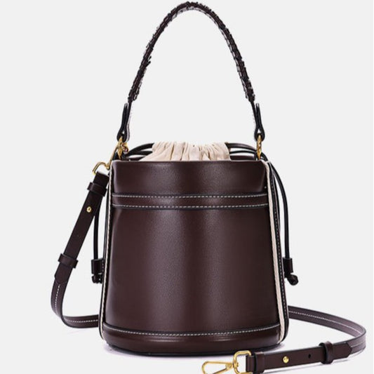 Brown Cylindrical Tote Bag With Dual Handles, Designed For Handheld Or Crossbody Wear