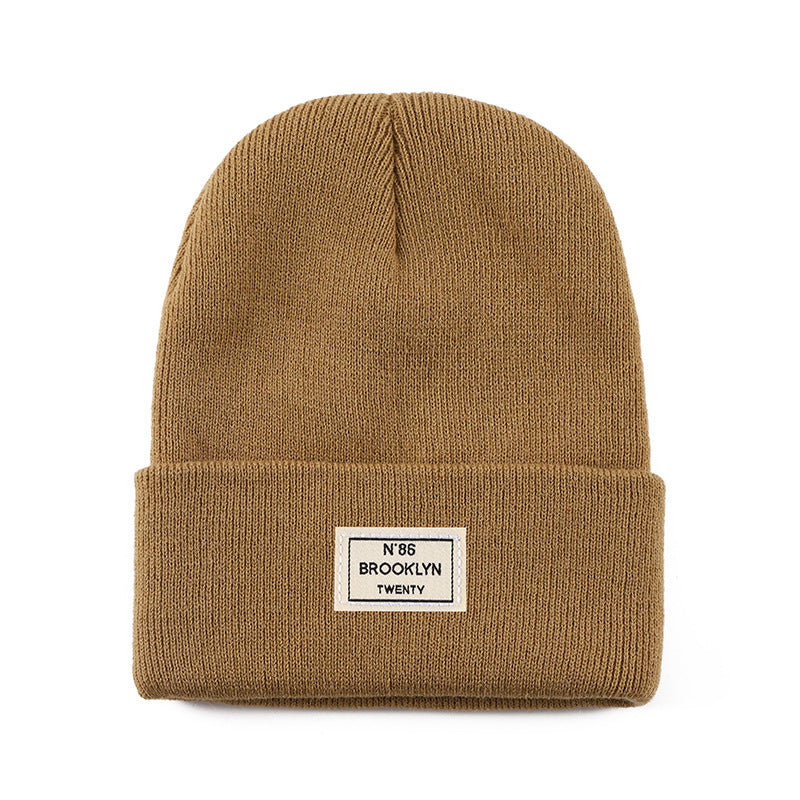 Knitted Beanie With Brand Label Stylish And Fashionable