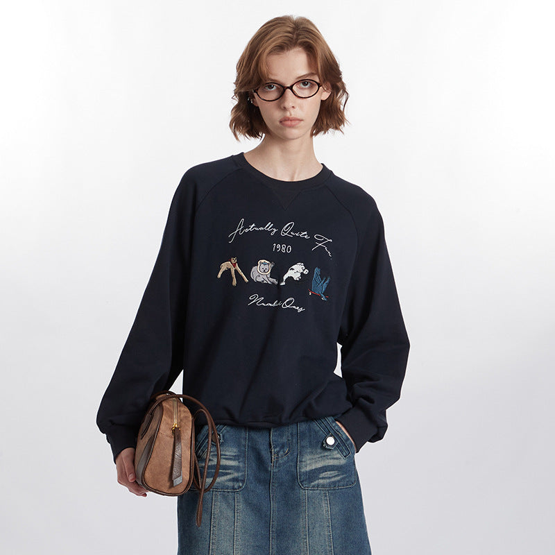 Rundhalset Løs Retrosweater Med Broderet Design Og Lange Ærmer