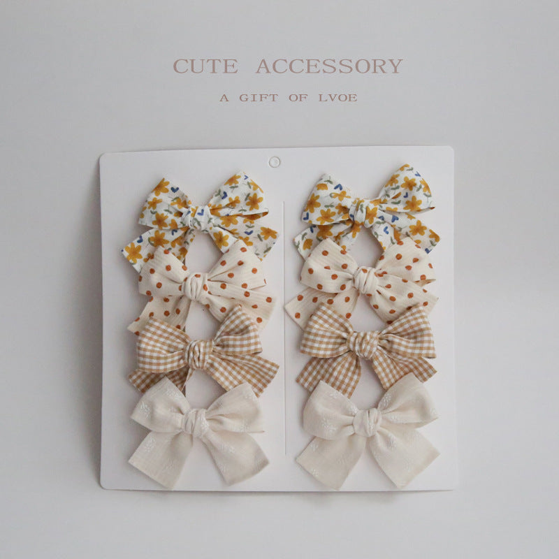 Dovetail Bow Around A Pair Of Hairclips 1 Group