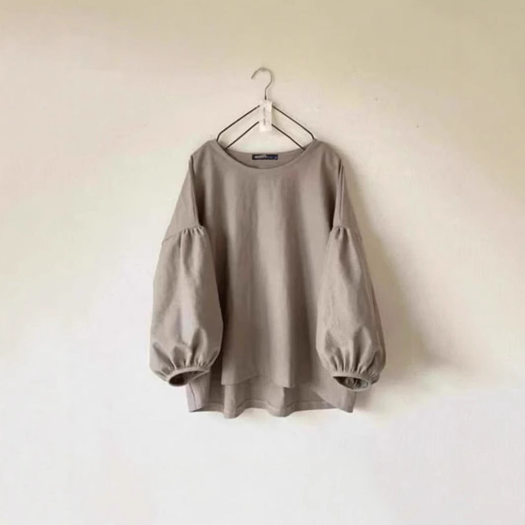Løstsiddende vintage T-shirt til kvinder med rund hals og pufærmer