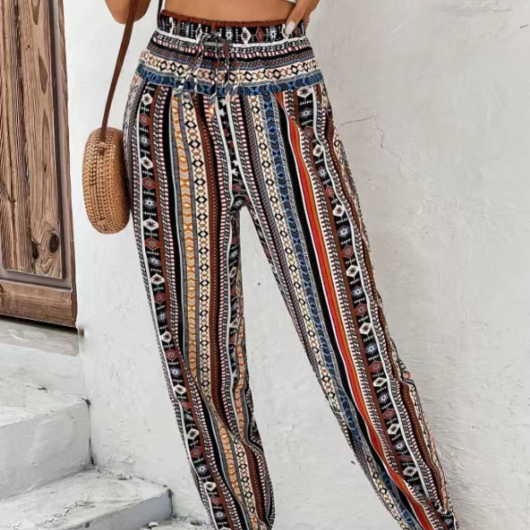 Løs, tilspidset jumpsuit med print, snøre, blomsterprint og lommer
