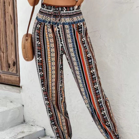 Løs, tilspidset jumpsuit med print, snøre, blomsterprint og lommer