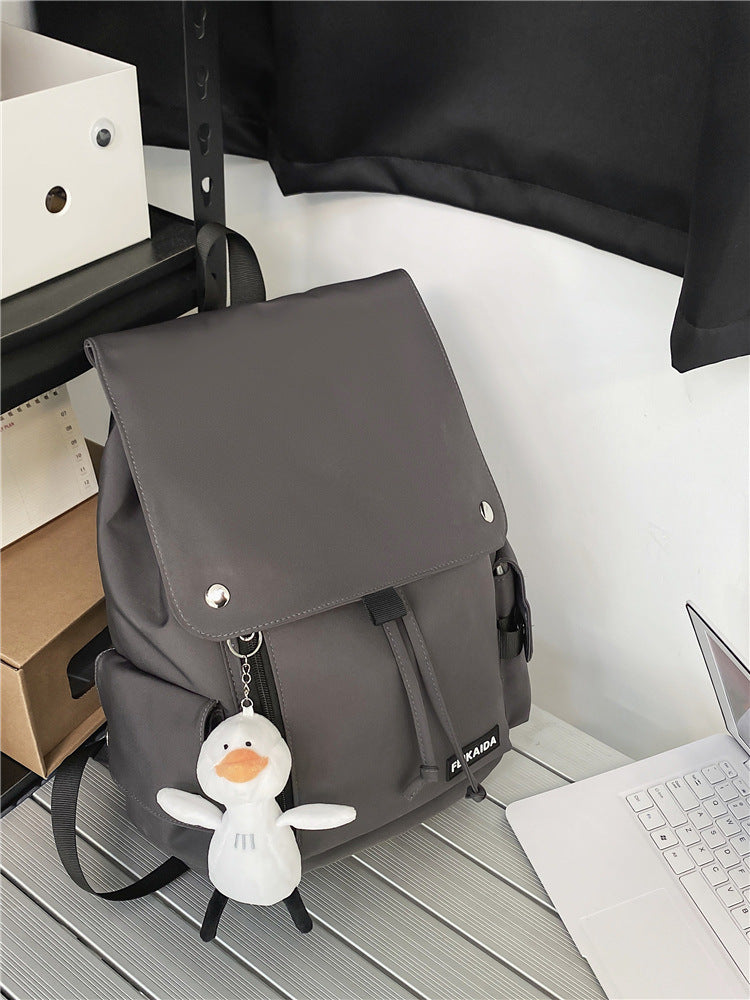 Trendy studietaske med lodret lynlås