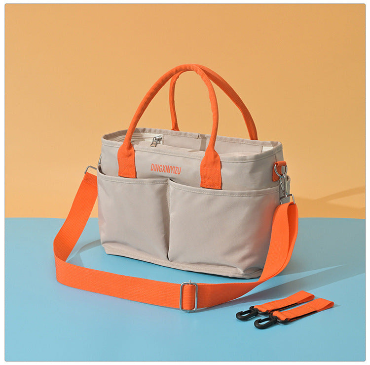 Mommy's Maternity Bag Can Be Attached To A Stroller
