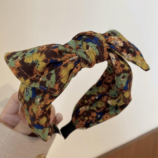 Simple Wide-brimmed Fabric Hairband With A Printed Pattern And A Tied Knot
