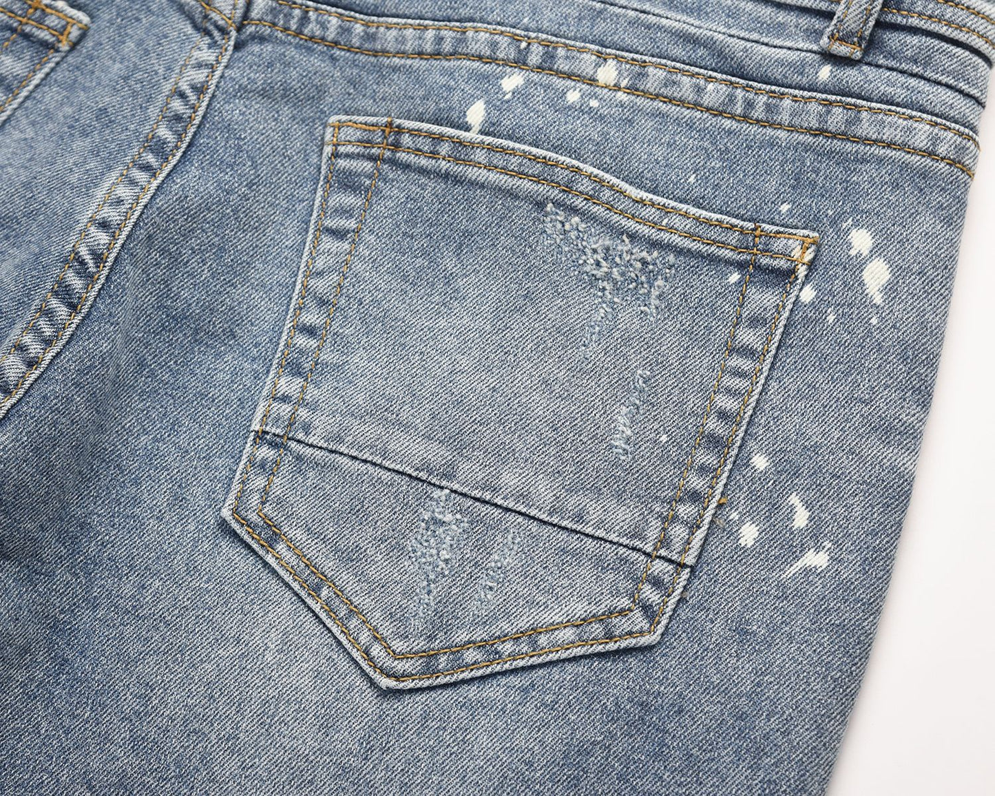 Light Blue Jeans With Splashed Ink And Ripped Elastic Wash