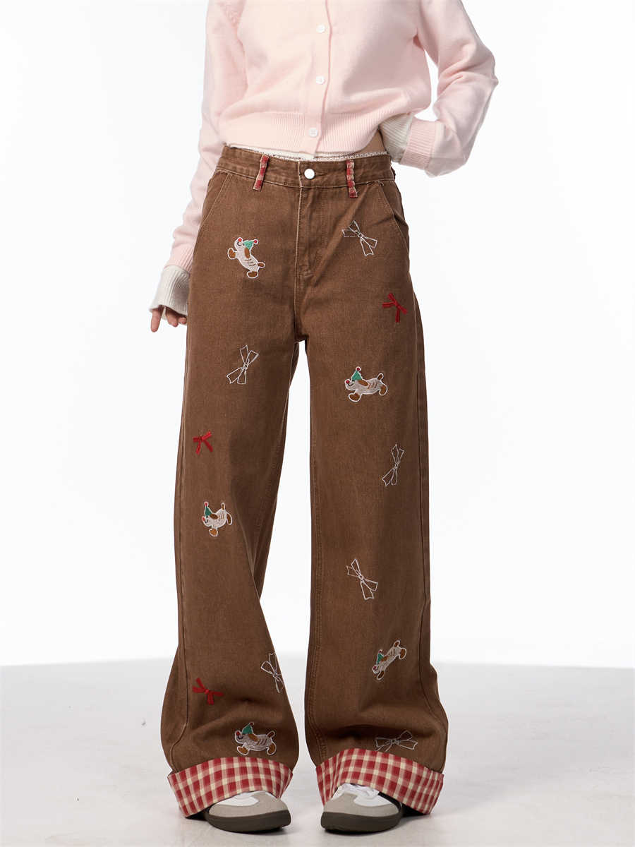 Vintage jeans med broderet sløjfe, hvalpemotiv og vide ben samt høj talje
