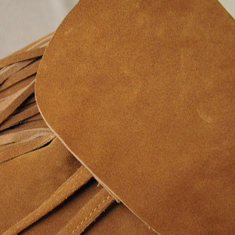 Matte Cowhide Suede Tassel Drawstring Backpack