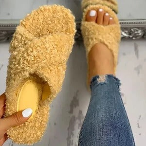 Cross hairy slippers to keep warm at home