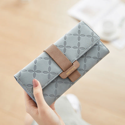 Three-fold wallet with belt buckle