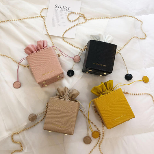 Chain drawstring crossbody bag