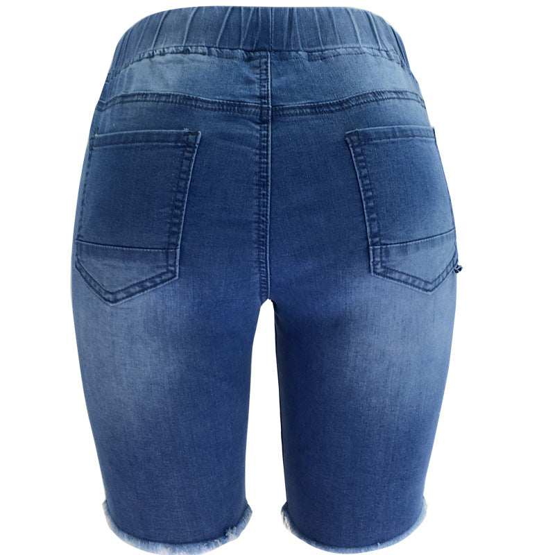 Medium-Washed Blue Jeans With Holes In The Pants