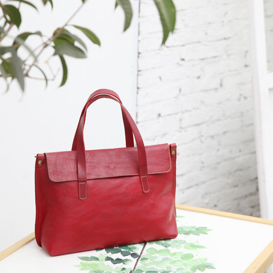 Håndbåret crossbody-taske i vegetabilsk garvet læder til kvinder