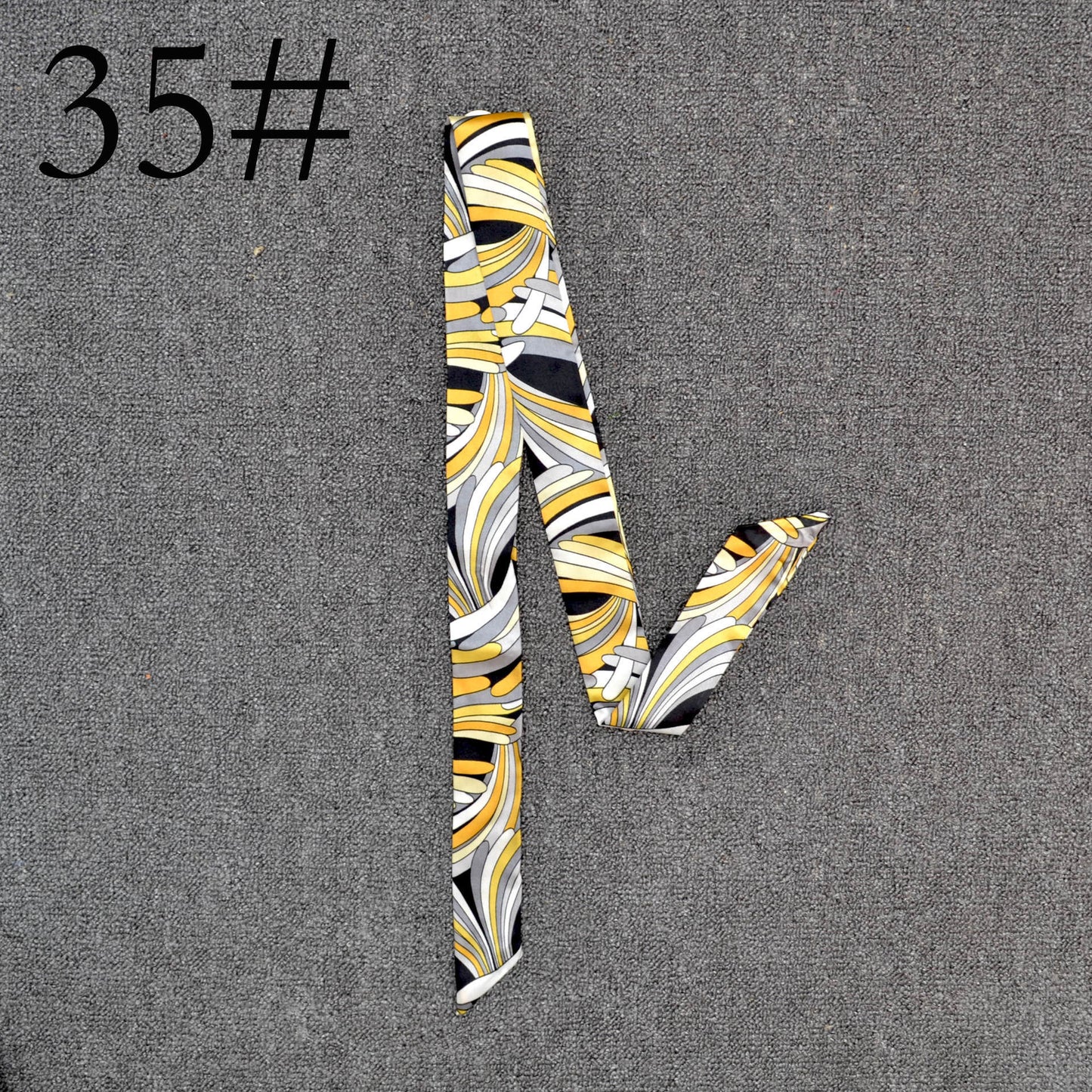 Long Scarf Tied With A Small Ribbon Wrapped Around The Handle Silk Scarf