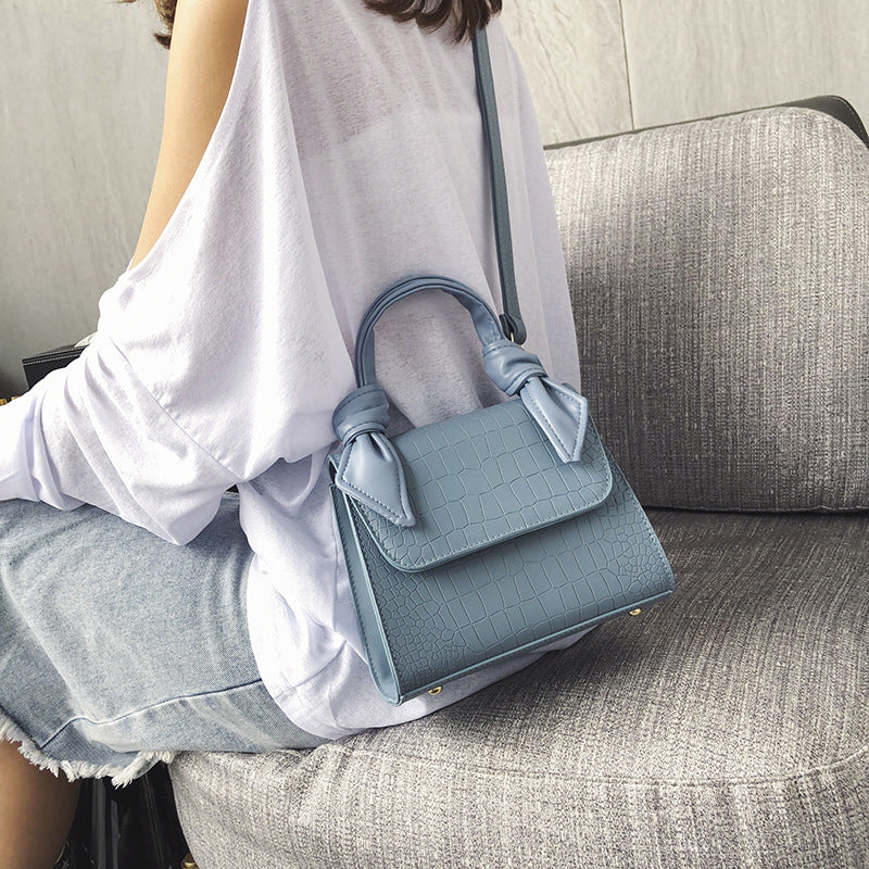 Stone-grained shoulder-slung crossbody bag