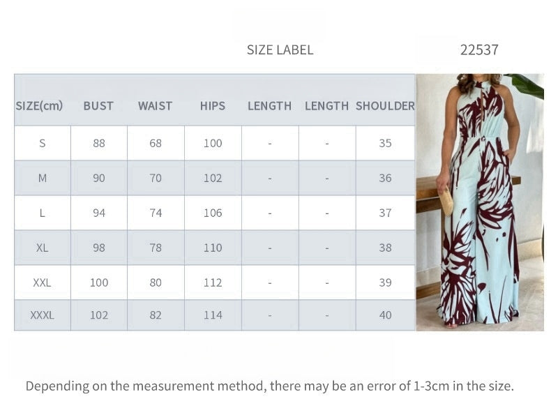 Sommerlig, elegant og moderigtig ærmeløs jumpsuit med halv rullekrave, print, hulmønster og snøret vidde ben