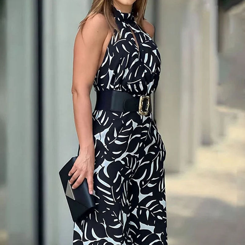Sommerlig, elegant og moderigtig ærmeløs jumpsuit med halv rullekrave, print, hulmønster og snøret vidde ben