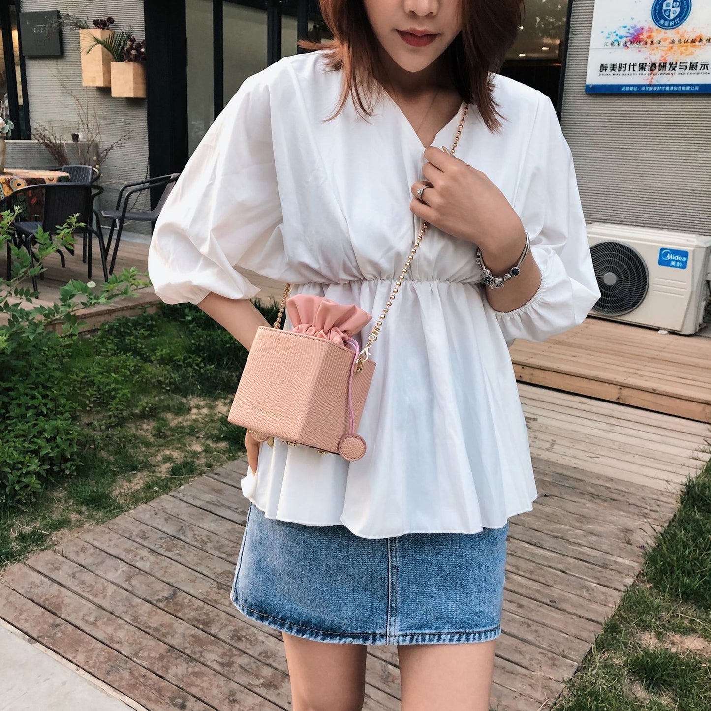 Chain drawstring crossbody bag