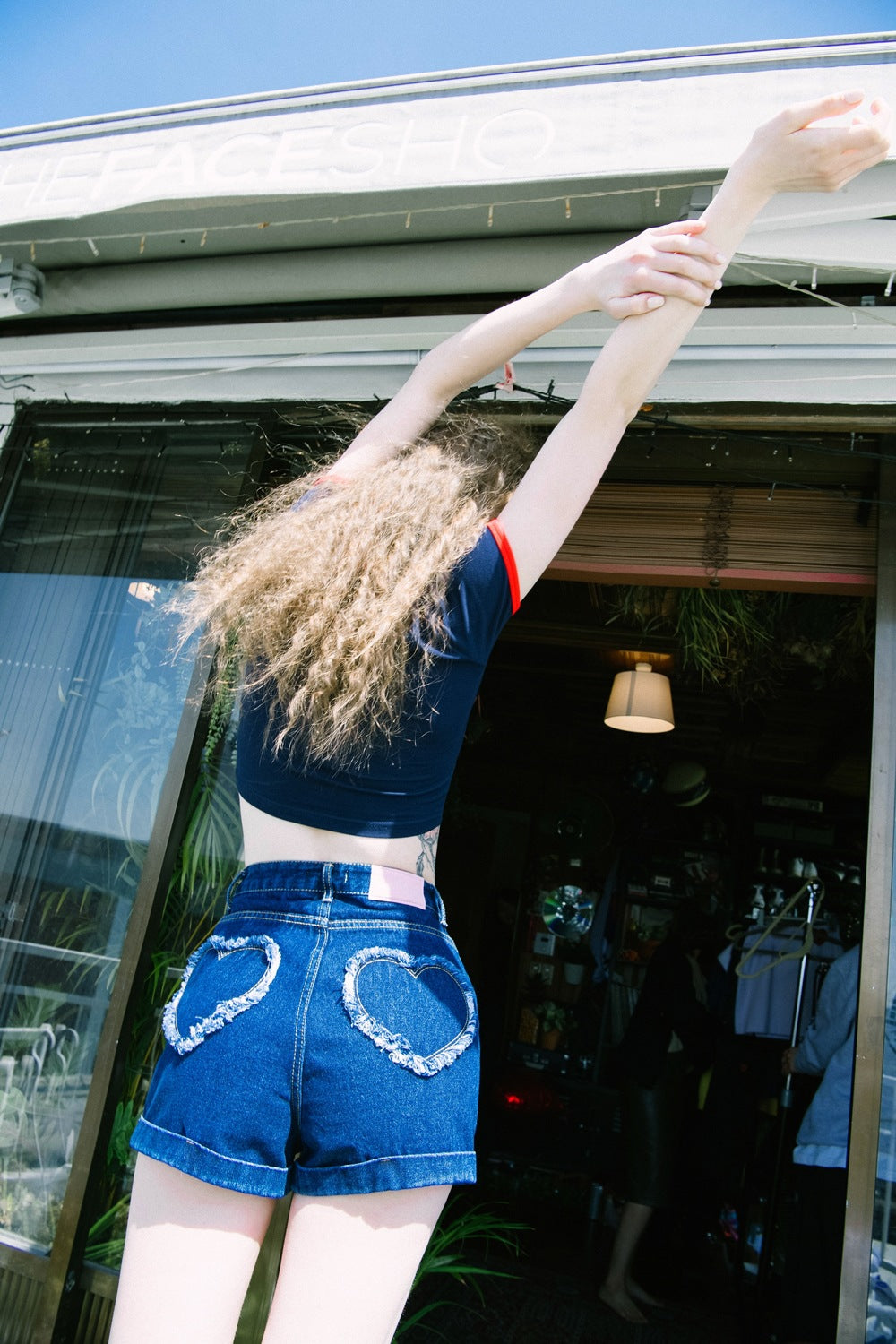 Heart shaped hip pocket embellishment denim shorts