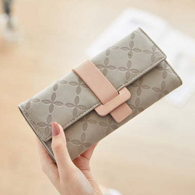 Three-fold wallet with belt buckle