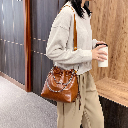 Pleated portable shoulder bag