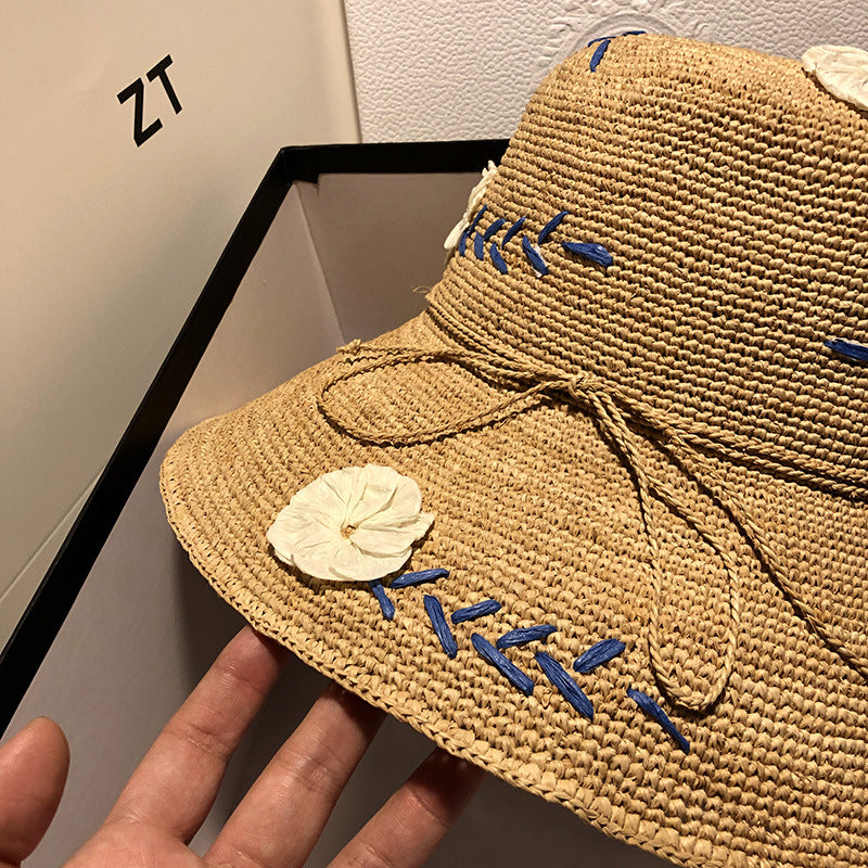 Women's Raffia Hat With Embroidered Flowers On Vacation By The Sea