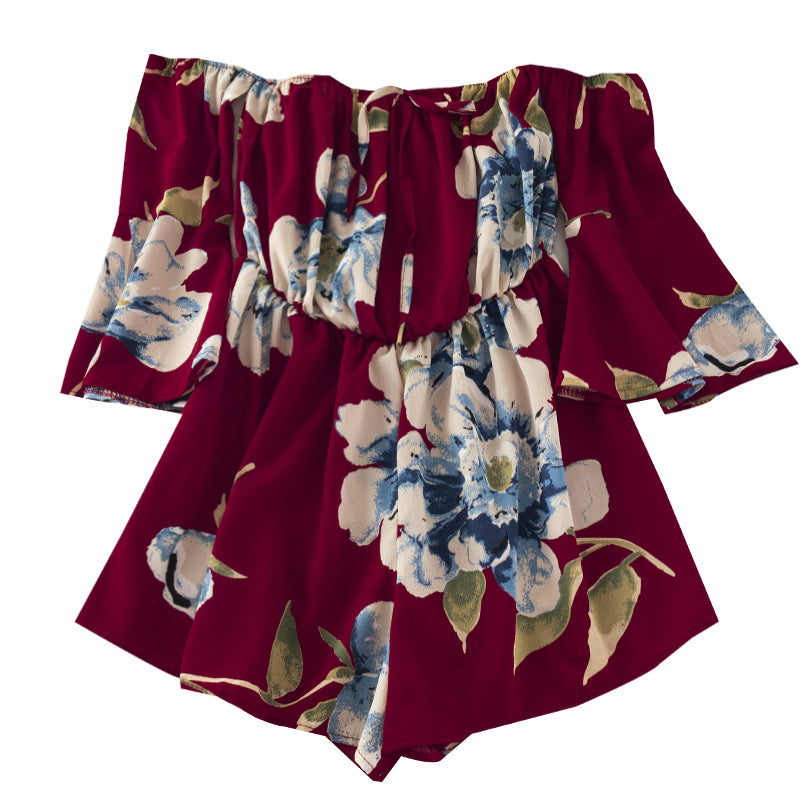 Off-shoulder buksedragt med blomsterprint og flæsede ærmer med bindebånd