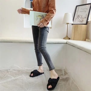 Cross hairy slippers to keep warm at home