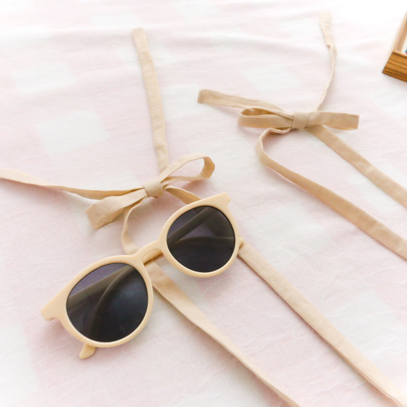 Bow-tied flounces with suspenders