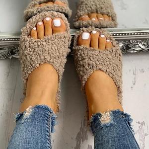 Cross hairy slippers to keep warm at home