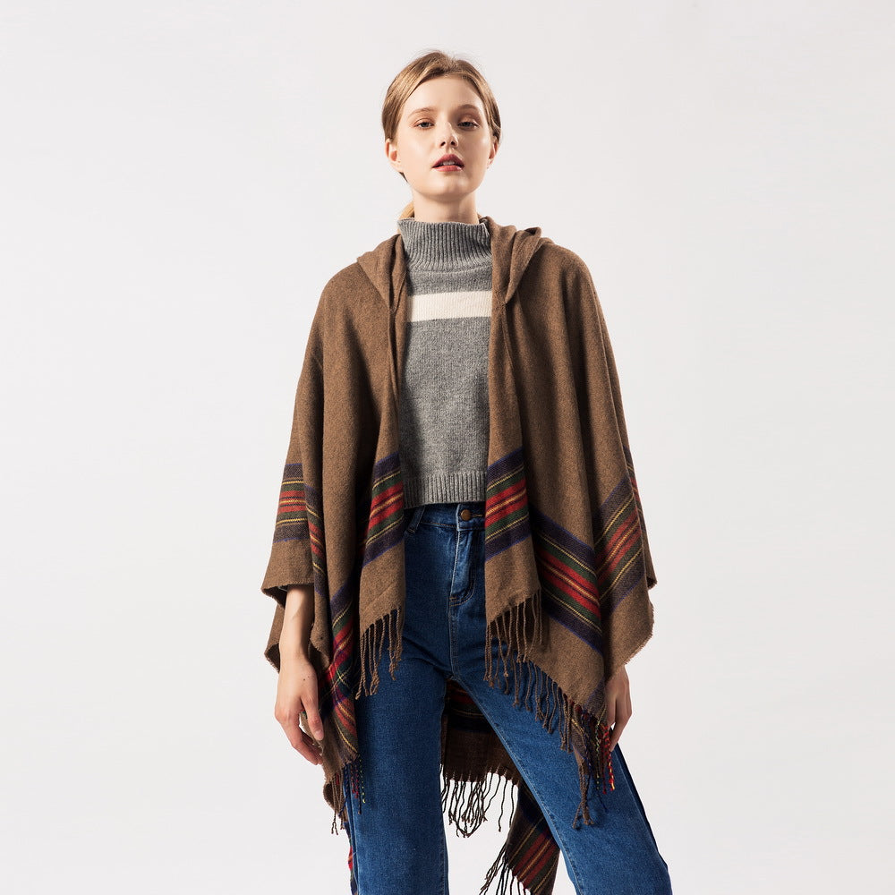 Keep warm by adding a stylish hooded cape