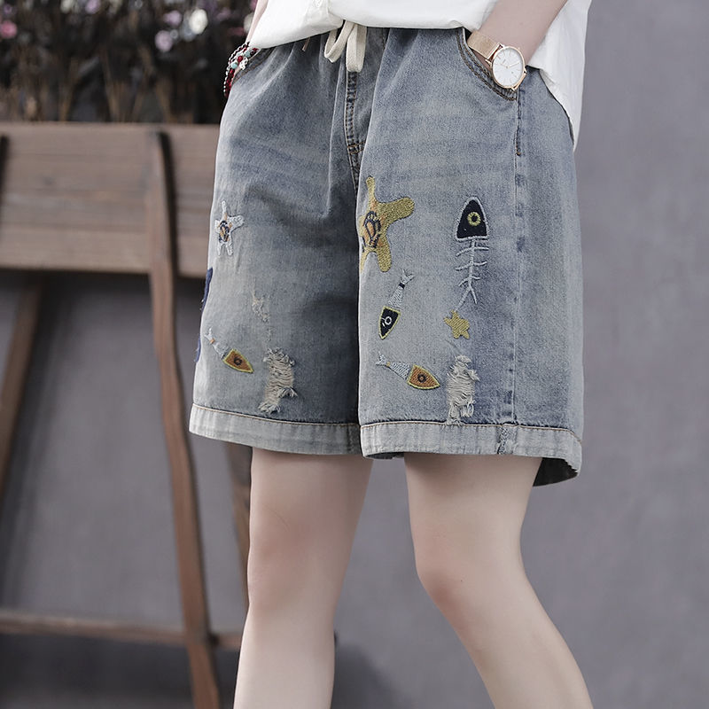 Alsidige shorts med elastiktalje, broderede huller og brede ben i vintage-stil