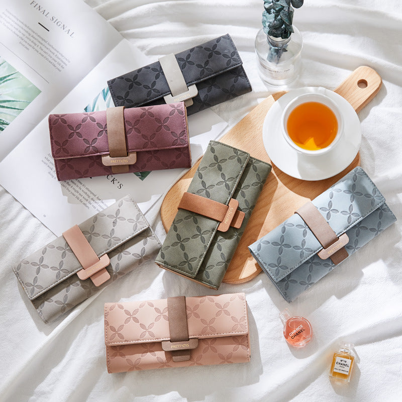 Three-fold wallet with belt buckle