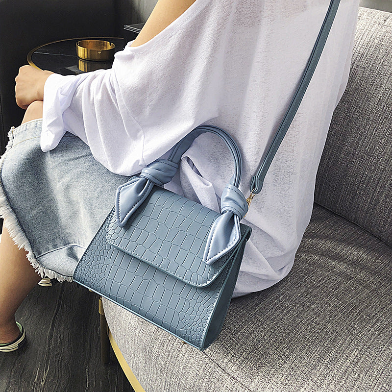 Stone-grained shoulder-slung crossbody bag