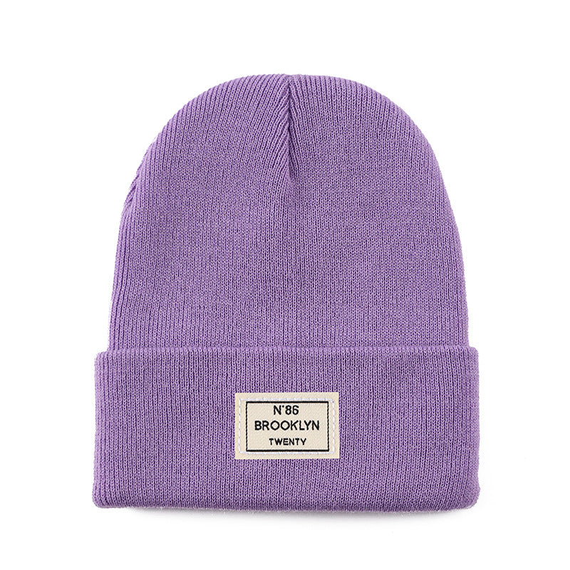 Knitted Beanie With Brand Label Stylish And Fashionable
