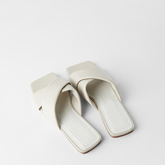 Nude quilted calfskin flat sandals