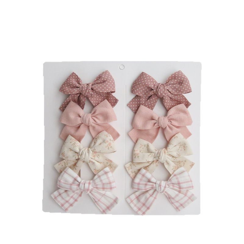 Dovetail Bow Around A Pair Of Hairclips 1 Group