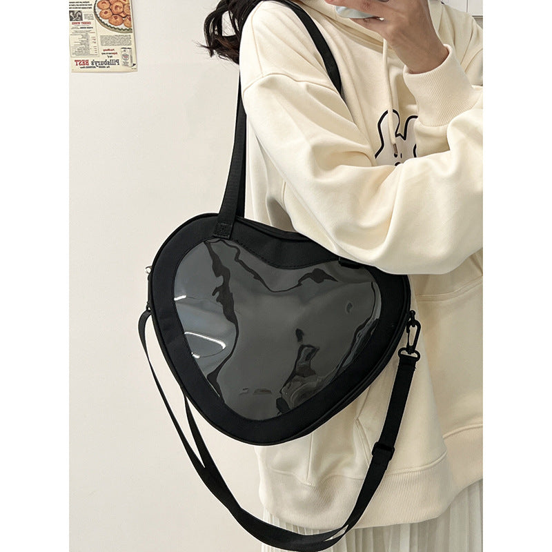 Enkel alt-matchende hjerteformet gennemsigtig hånd-crossbody-taske