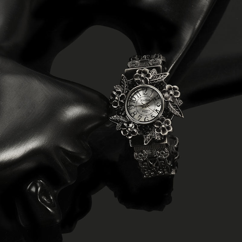 Embossed flower quartz watch